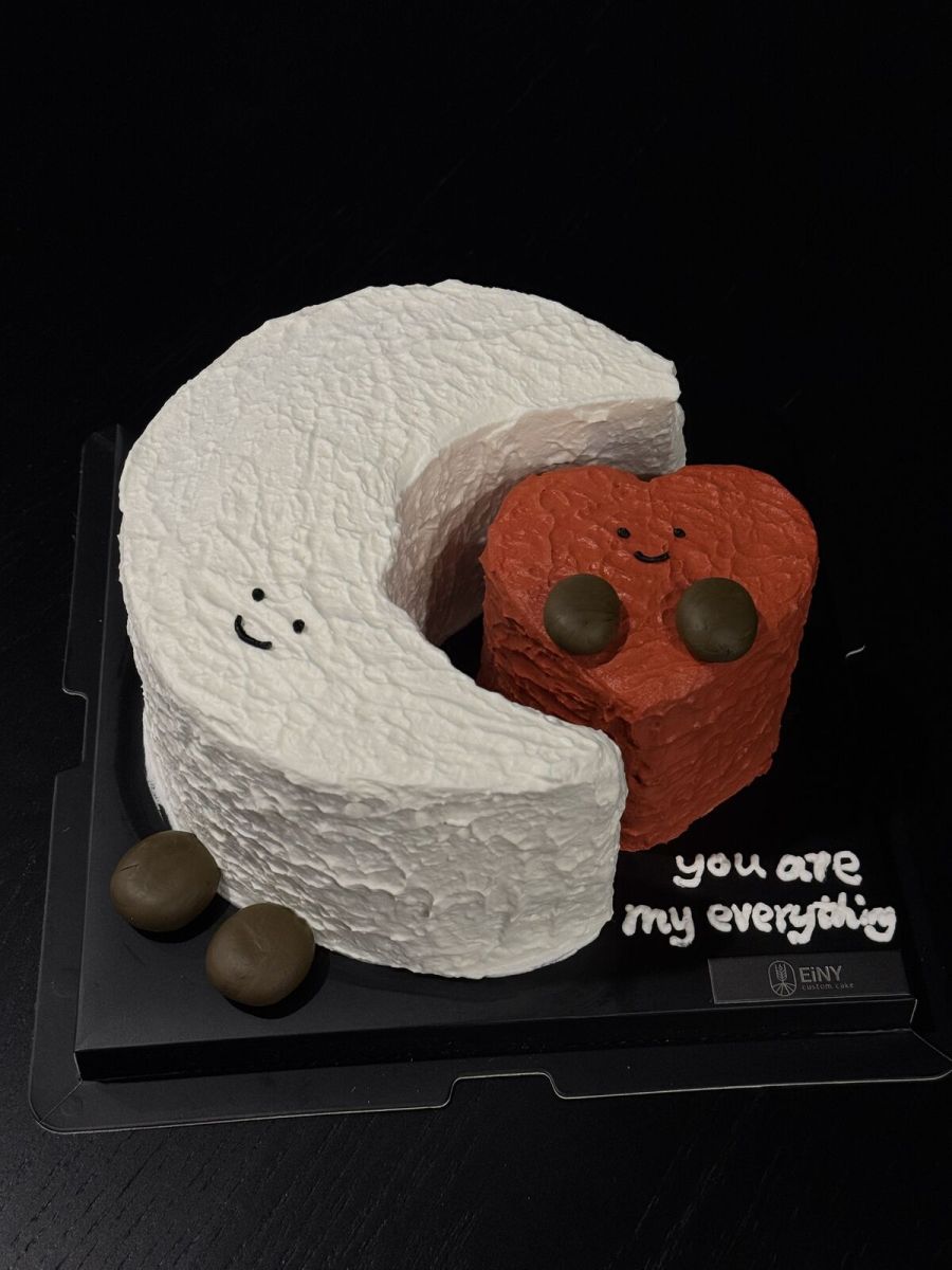 Crescent moon cake hugging a little red heart, with you are my everything piped on the board